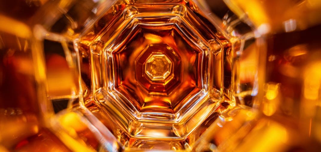 Warm amber light through glassware