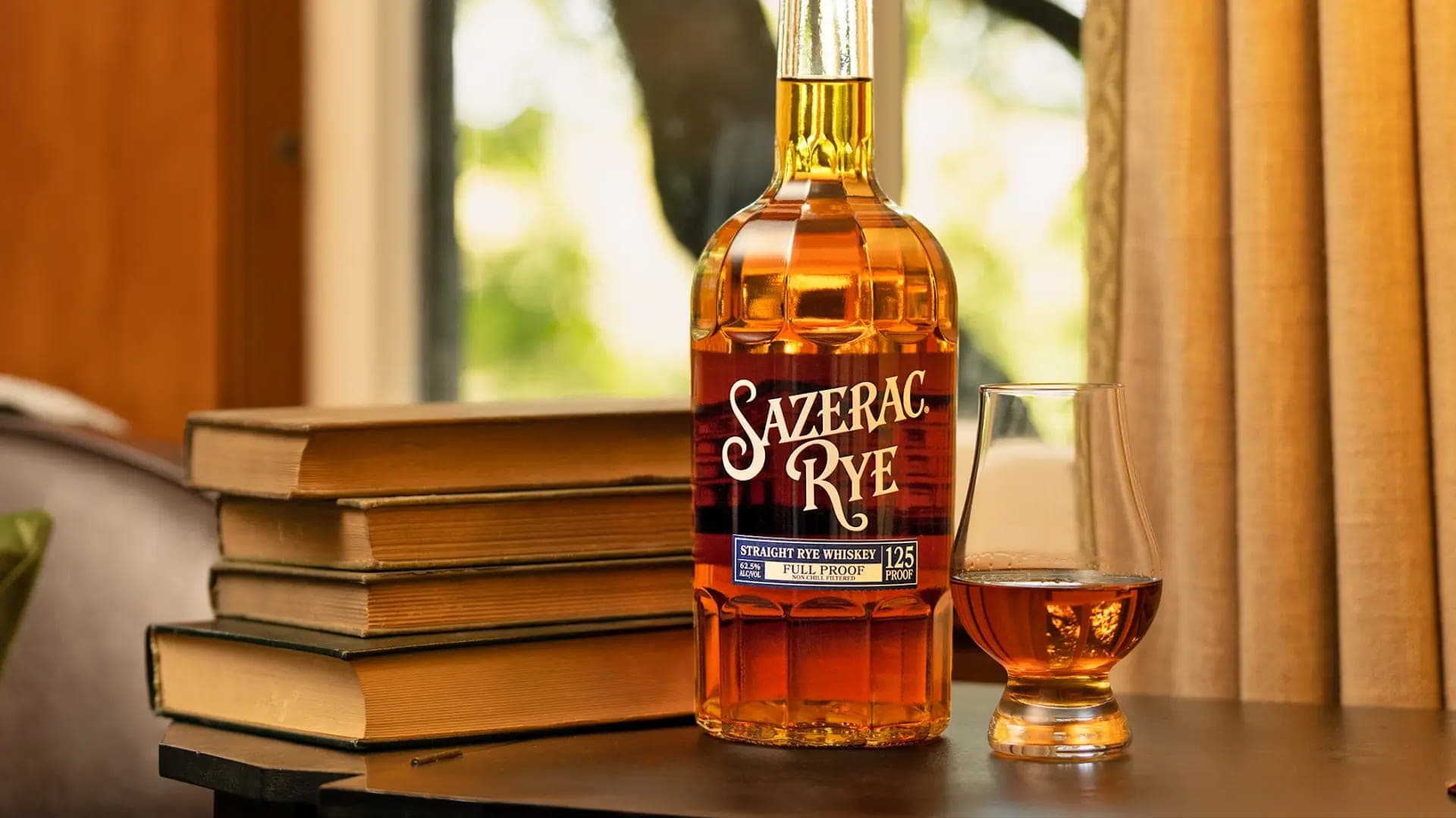 A bottle of Sazerac Rye beside a filled glass